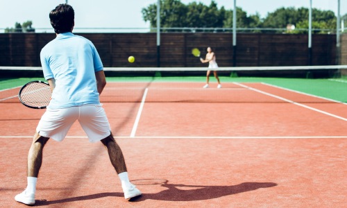 people on tennis court
