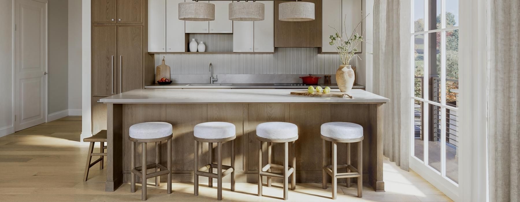 a kitchen with a marble island